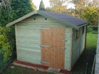 10 x 16 Workroom with standard doors & windows, but with a brown polyester felt roof. 