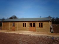 40 x 20 Farm Shop with green felt roof, and garden office doors & windows. 