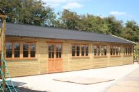 60 x 20 Farm Shop with garden office doors and windows, and a black onduline roof. 