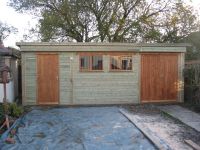 22 x 11 Pent Roof Workroom with framed ledged & braced doors. Also features 2 garage windows with grilles