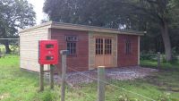 Extended building - 30 x 12 with a mono pitched roof and georgian windows. Dark sections were originally from another building.