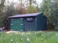 Feather Edge clad lawnmower store, stained in Spruce green wood protector. 