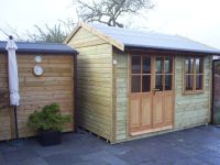 Workroom with single glazed garden office style doors and windows.