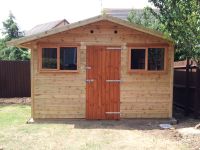 12ft wide Workroom with standard windows and door all on the front gable end.