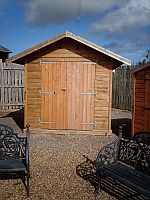 Small workroom with double doors in the gable end.