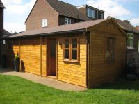 10 x 30 Workroom with a Felt Tile Roof, and garden office door and windows. 