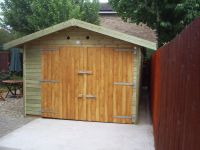 12 x 16 Workroom with large double doors. This building is 2.5m high.