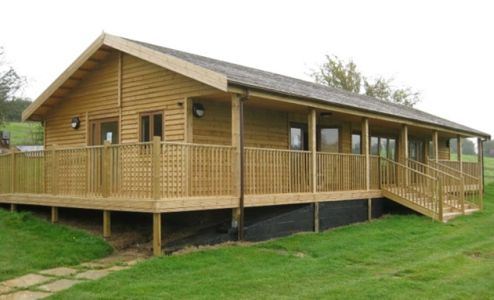 Colne Valley Village Hall, which has Cedar Shingles and Bi-fold Doors.  